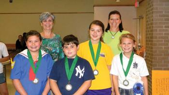 SEAFOOD WINNERS - Standing in front, from left, are the winners of the Seafood Division categories, Kylie LeBas, crab; Jake Manuel, shrimp; Annabeth Briley, fish and other seafood; and Ava Shiver, crawfish. They are shown with Guillory and Buller.